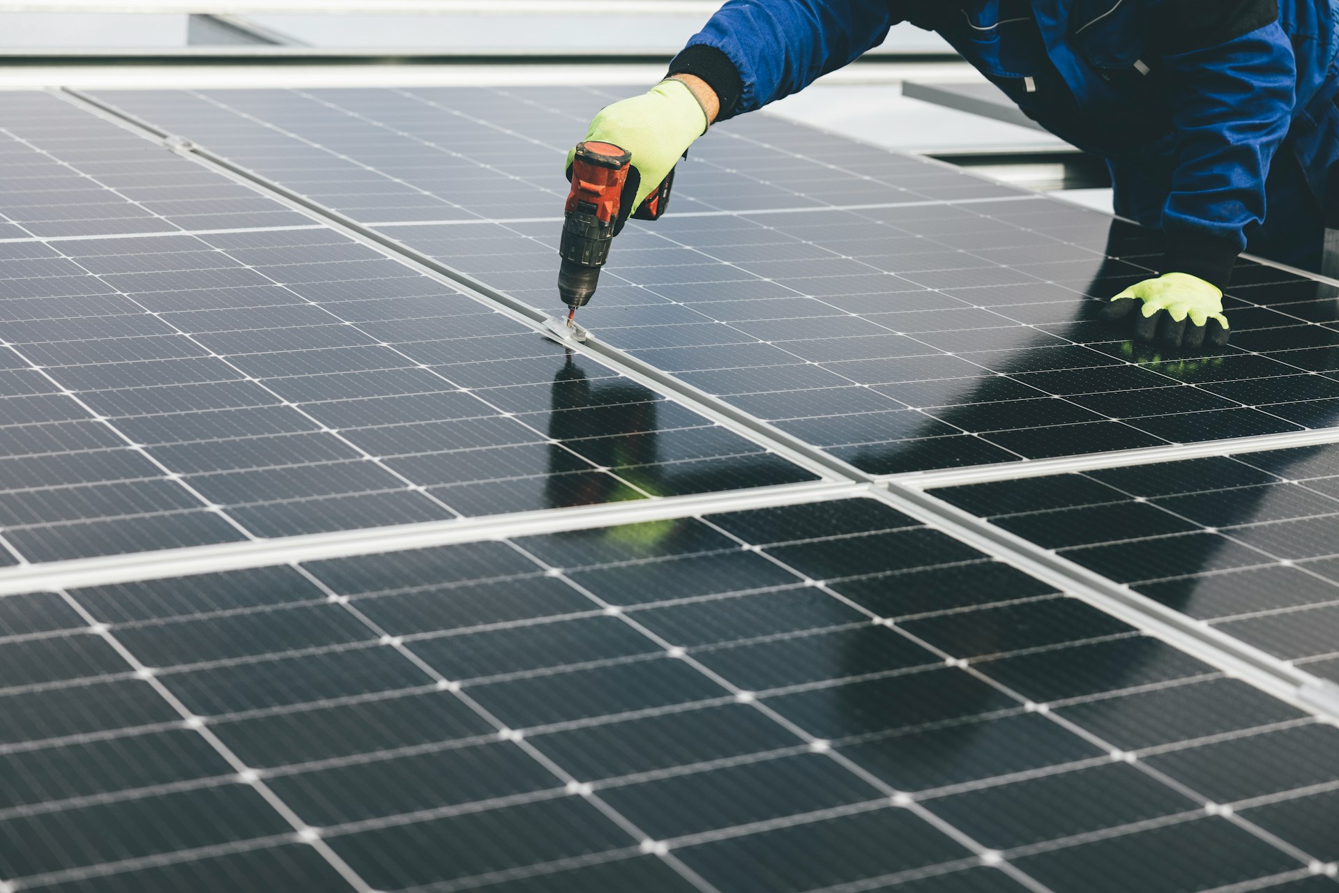 A person working on a solar panel